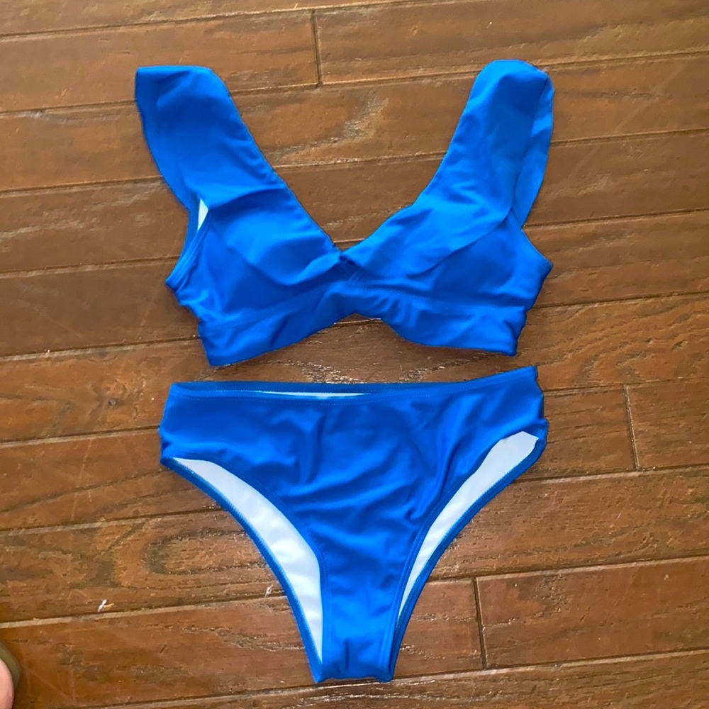 Rock the sand in this Royal Blue ruffle bikini sz small